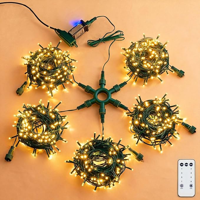 String lights with a central connector and remote control on an orange background
