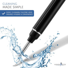 Close-up of the ear wax removal tool featuring a sleek black handle and a shiny, cleanable silicone head, with water splashes artistically surrounding it, emphasizing hygiene and ease of cleaning.