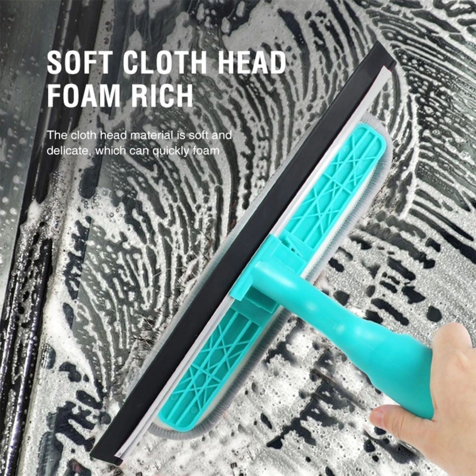 Close-up of the squeegee's soft cloth head, showing its light blue color and textured grip, alongside soapy water on a glass surface highlighting its cleaning capability.