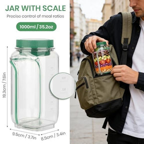 The clear salad mason jar features a green lid and has measurement markings along the side for precise portion control. A person is placing the jar, filled with colorful salad ingredients, into a backpack while standing outdoors.