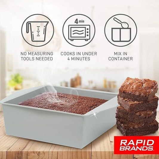 Square, gray microwave brownie maker displaying warm, freshly baked brownies with steam rising from the surface, accompanied by stacked brownies on the side.