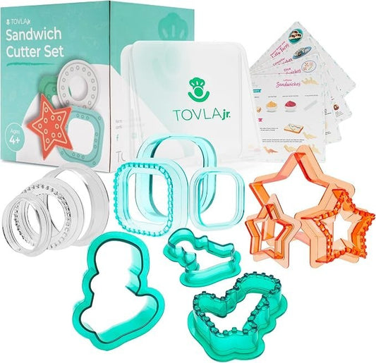 Colorful sandwich cutters in fun shapes, including stars, a ghost, and a snowman, along with a container and recipe cards, presented in a vibrant packaging. The set is designed for creating playful, themed sandwiches suitable for children.