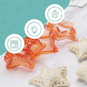 Four star-shaped sandwich cutters in vibrant orange plastic are displayed on a light surface, alongside several cut sandwich pieces. Icons indicating features like dishwasher safety and creativity enhancement are visible in the upper area.