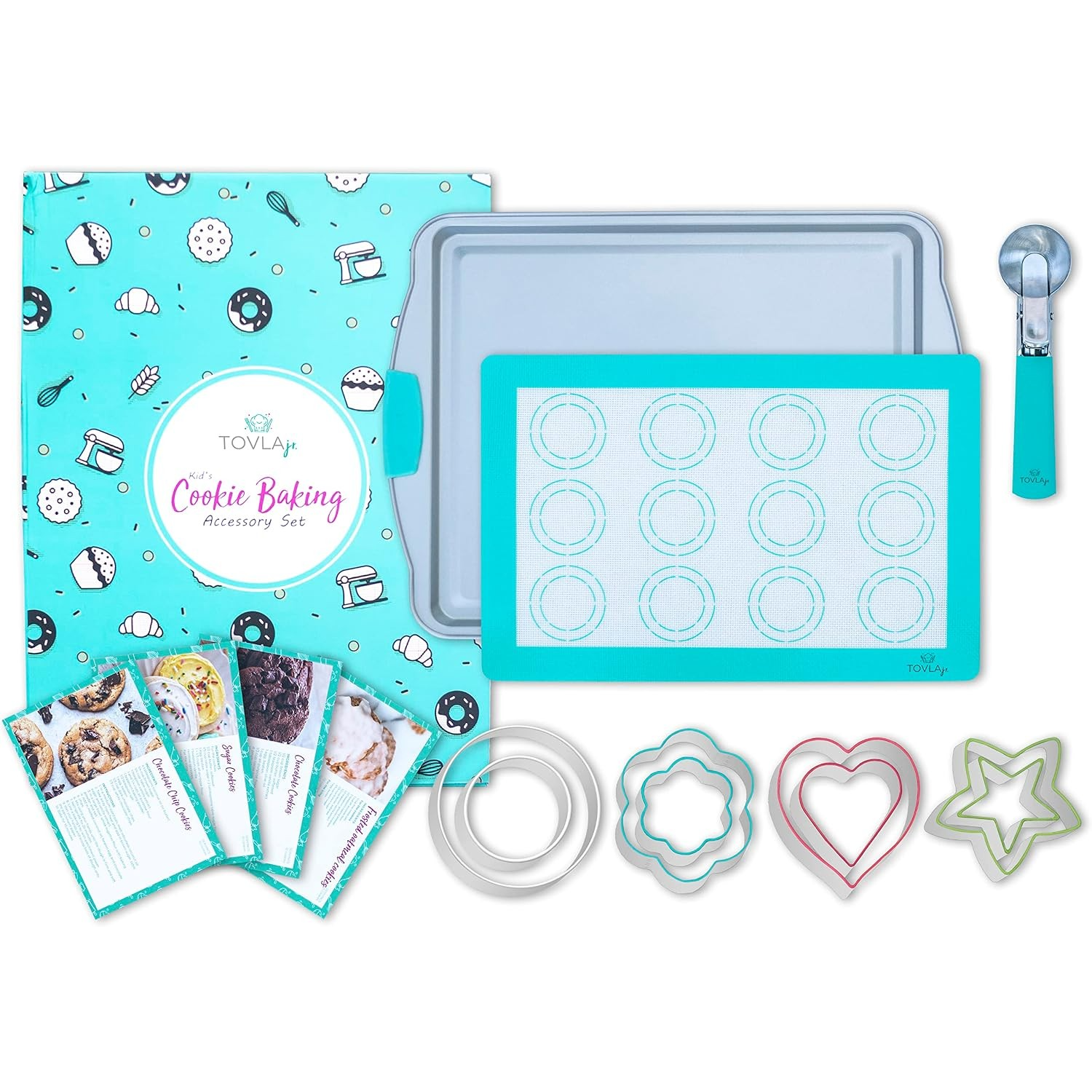 Colorful accessories for cookie baking including a turquoise silicone baking mat with circular outlines, a silver baking sheet, a metal scooper, and various cookie cutters in star, heart, and flower shapes, all arranged on a light background.