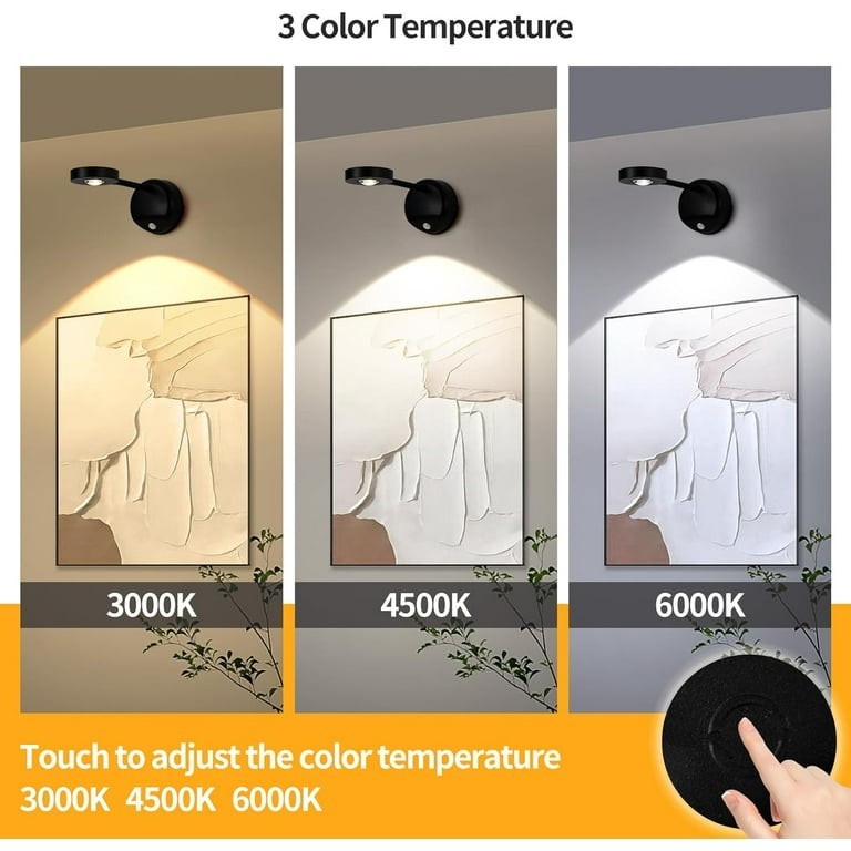Three orientations of a wireless motion sensor picture spotlight mounted on walls, illuminating an artwork with varying light temperatures (3000K, 4500K, and 6000K), depicted in black against a neutral background with a touchpad interface shown for adjusting colors.