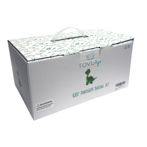 Box featuring a whimsical dinosaur design, labeled as the "Kids' Dinosaur Baking Set" by Tovla Jr., with a carrying handle on top and a warning label for small parts.