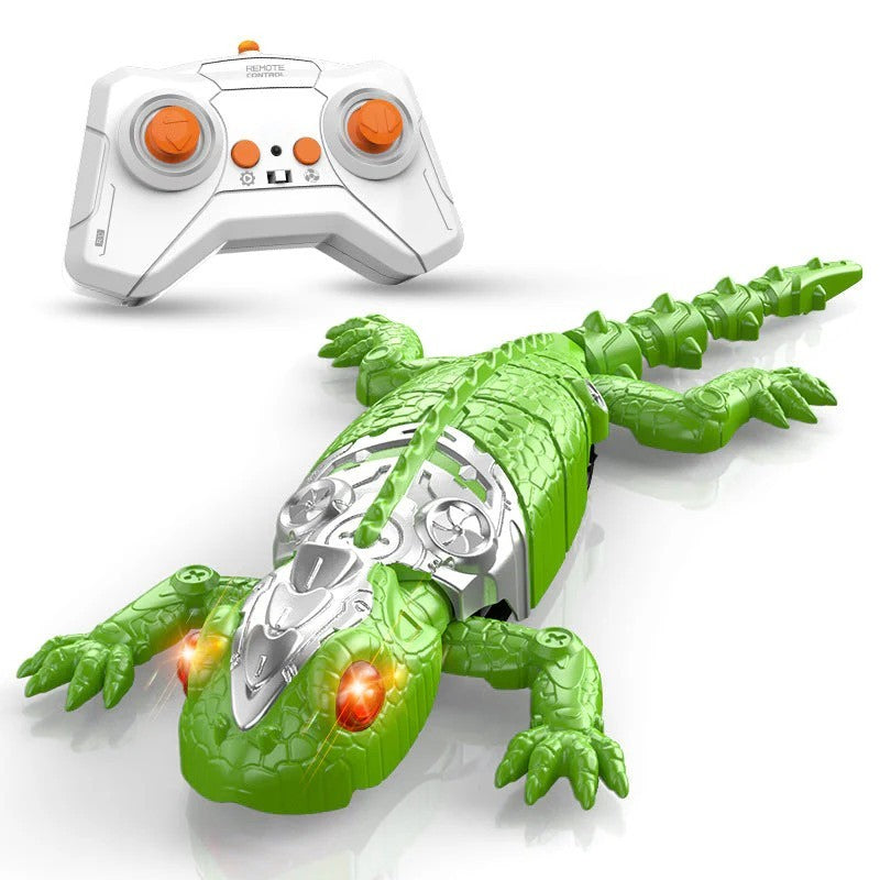 Remote control lizard toy in vibrant green with a shiny silver control panel on its back, featuring glowing red eyes. The white remote control with orange buttons is positioned above the lizard, showcasing its design and function.