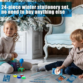 Two children are playing with various colorful stationery items on a soft rug in a cozy indoor setting decorated for winter, featuring a snow-themed design on the stationery and a festive tree in the background.
