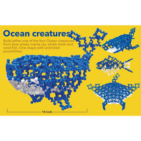 Colorful ocean creatures built from interlocking blue and white pieces, showcasing a blue whale on the left and three additional models on the right, with a bright yellow background and a scale marker indicating a length of 10 inches.