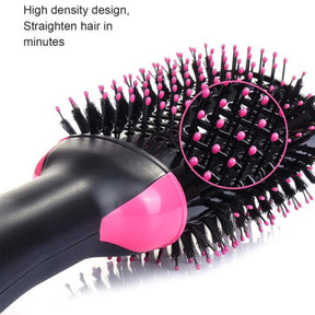 Close-up of the 3 In 1 Hot Air Brush showing its high-density bristles in black with pink tips, designed for efficient straightening, along with the ergonomic black handle featuring pink accents.