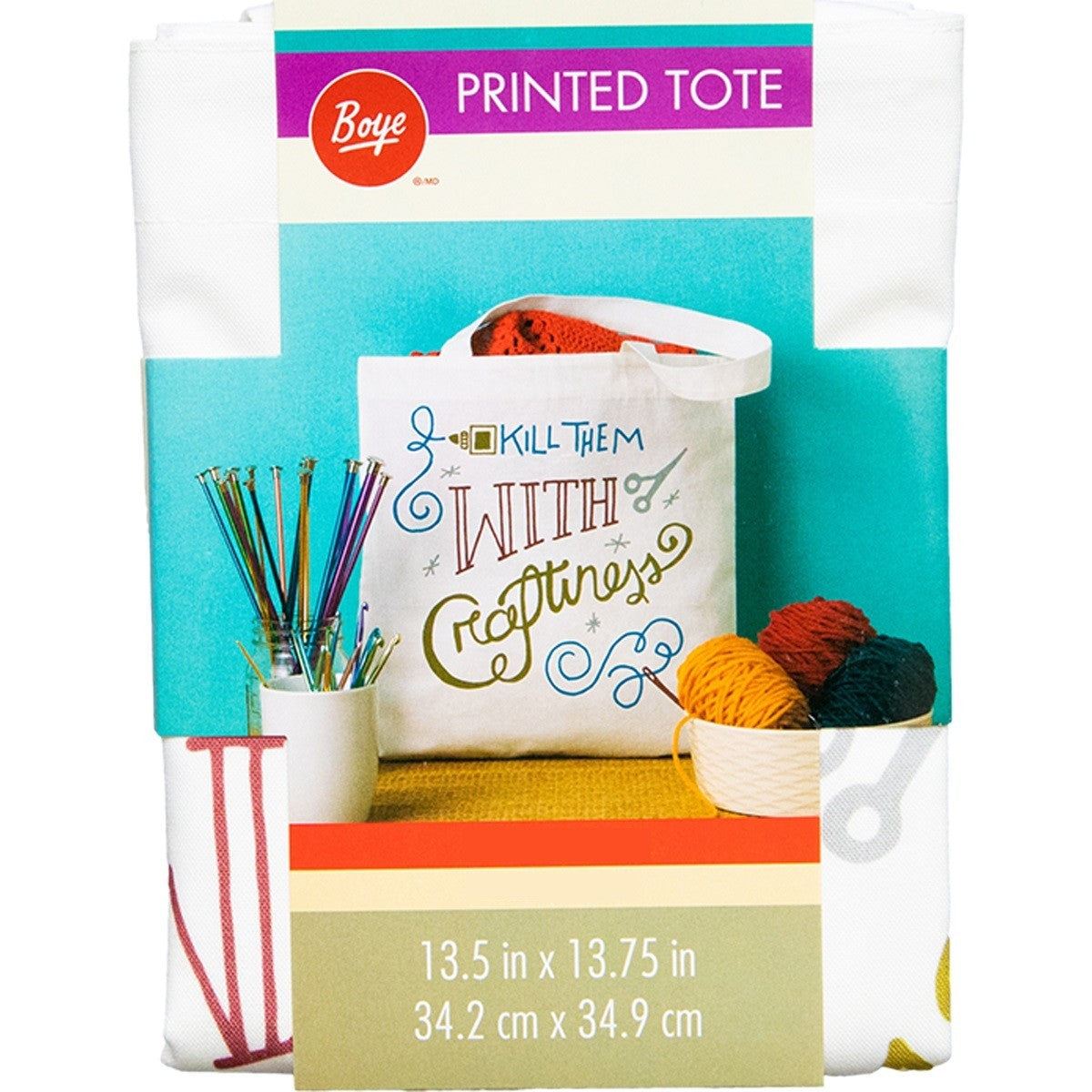 A person is holding a white canvas tote bag featuring colorful text that reads "Kill Them with Crafting," along with images of scissors and a knitting needle, showcasing its playful design. The bag is being carried on the shoulder against a black jacket.
