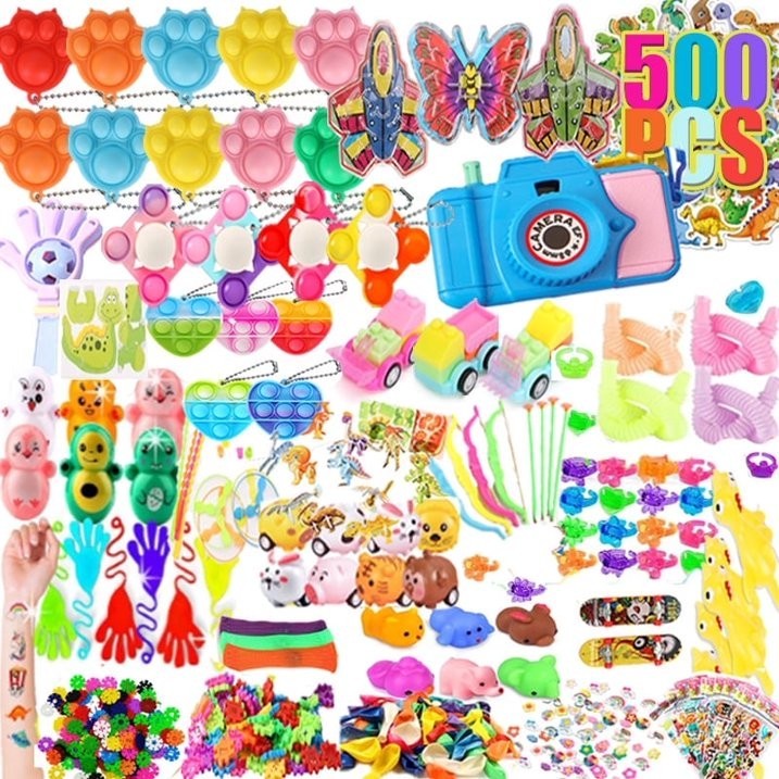 A vibrant assortment of 500 small toys, including colorful figures, playful gadgets, and novelty items, arranged in a variety of shapes and sizes, perfect for parties and rewards. Bright colors like pink, yellow, green, and blue dominate the collection, showcasing items such as mini cars, animals, and playful fidget toys.