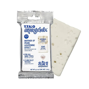 The T.Taio Esponjabon features a rectangular soap infused with mother of pearl, with a textured surface and visible speckles, packaged in a silver wrapper that highlights the product's 2-in-1 functionality. The label displays key benefits such as "Sponge Inside" and "Soap Outside," along with specific claims about its suitability for all skin types.