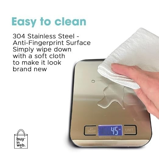 A hand is wiping the stainless steel surface of the digital food scale with a soft cloth, showcasing its anti-fingerprint feature. The display shows a weight reading of 45 grams.