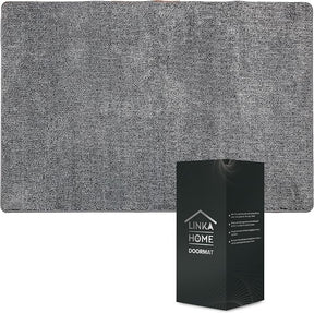 The gray doormat features a textured surface and rounded corners, measuring 23 x 35 inches, with a black box displaying the brand name "Linka Home" and product details in the bottom corner.