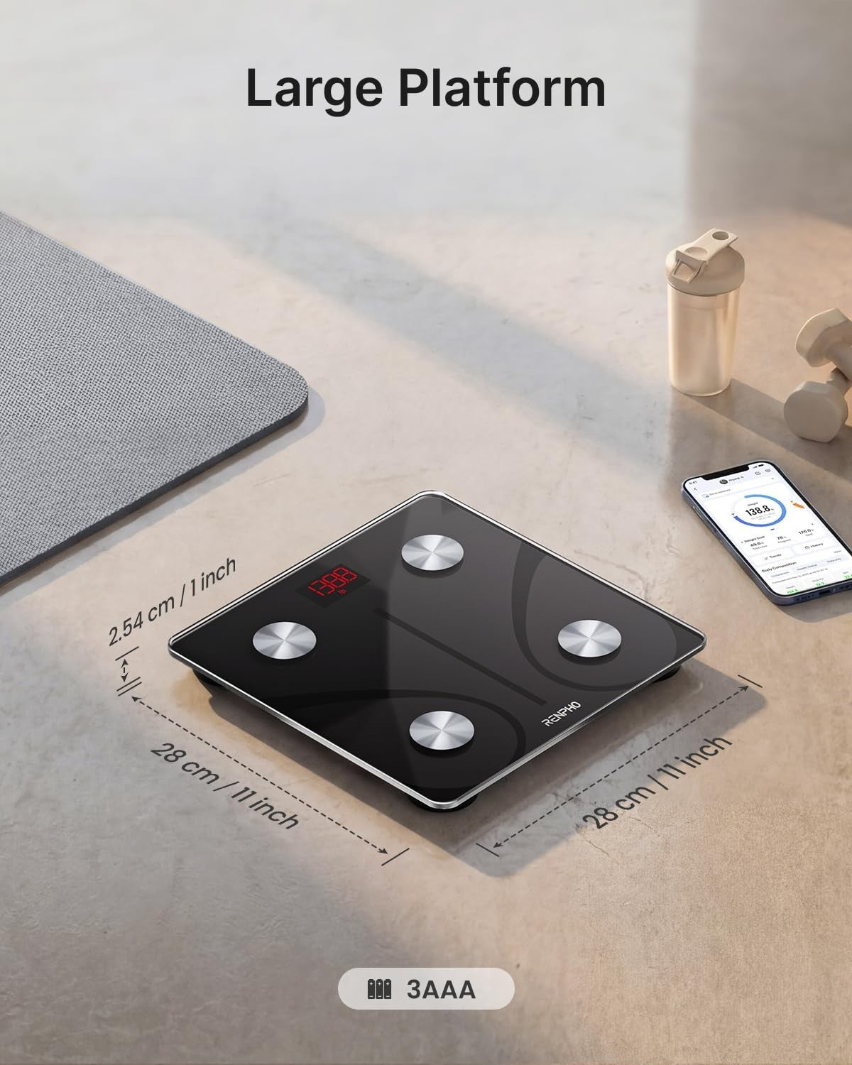 The smart scale features a large black platform with a sleek design, measuring 28 cm by 28 cm and 2.54 cm thick, accompanied by four metal feet for stability. A digital display is visible on the surface, and the image includes labels indicating dimensions and battery information.