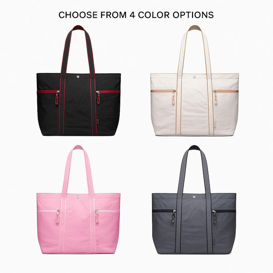 Four large lightweight canvas tote bags are displayed, featuring a black bag with red accents, a cream bag with tan accents, a pink bag with white accents, and a dark gray bag with black accents, each equipped with double top handles and two zippered front pockets.