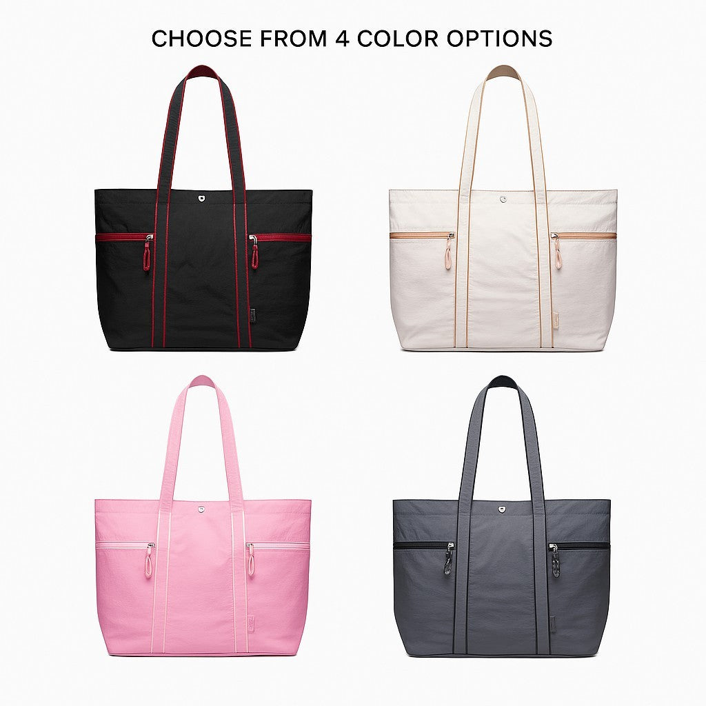 Four large lightweight canvas tote bags are displayed, featuring a black bag with red accents, a cream bag with tan accents, a pink bag with white accents, and a dark gray bag with black accents, each equipped with double top handles and two zippered front pockets.