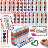 A colorful assortment of heart-shaped watercolor paint sets in various colors, neatly arranged with some sets stacked and a paintbrush shown in use creating a green heart. Includes playful branding cards that read "We've painted a great year together!"