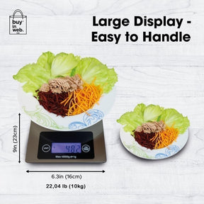 Digital food scale shown with a large display, supporting a plate of salad ingredients including lettuce, shredded carrots, and meat on top, displaying a measurement of 48.2 ounces. The scale is sleek and stainless steel with a maximum capacity of 22 lb.