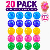 A collection of 20 glitter stress balls arranged in five vibrant colors: blue, purple, yellow, pink, and green, with four of each color, each measuring 2.5 inches in diameter. One ball is shown being squeezed by a hand to demonstrate its use.