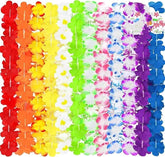 A vibrant collection of 24 assorted tropical lei necklaces displayed in a rainbow pattern, featuring flowers in shades of red, orange, yellow, green, blue, pink, and purple. Each lei has a soft, floral design that adds a festive touch to any occasion.