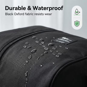 Close-up of the Foldable Weekender Tote Bag highlighting water droplets on the black Oxford fabric, showcasing its durable and waterproof qualities with a tag visible.
