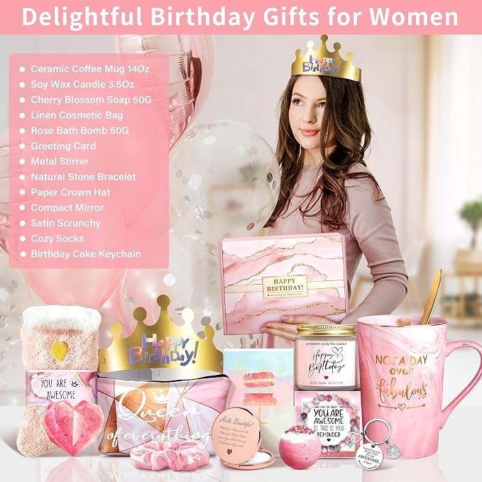 A woman wearing a crown holds a gift box with "HAPPY BIRTHDAY!" while surrounded by various pink-themed birthday gifts, including a ceramic mug, bath bomb, and a greeting card, all set against a soft background with balloons.