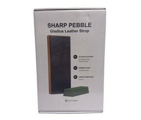 The box features the Sharp Pebble branding prominently at the top, with a black leather strop and a green sharpening compound illustrated. Text highlights include "Gladius Leather Strop" and details about its components: leather, bamboo base, and green compound.