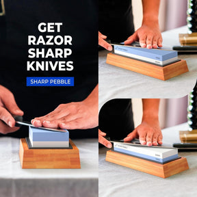 A person sharpens a knife on the Sharp Pebble whetstone placed on a wooden base, with the stone displaying 1000 and 6000 grit sides. The setting includes a light-colored tablecloth and kitchen utensils in the background.