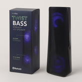 The tall, sleek black Bluetooth speaker features a textured mesh surface and glowing blue LED lights, set against a vibrant background on the packaging that highlights its wireless capabilities.