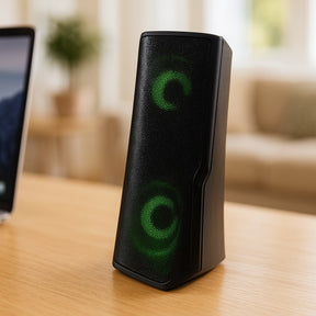 The sleek black Vibe Twist Bass Wireless LED Bluetooth Speaker features a modern, angular design with a textured grill and blue LED lighting effects visible on the speaker's surface.