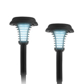 Two solar-powered bug zapper stakes in a sleek black design, featuring a curved light head with blue LED lights and a vertical slotted pattern for trapping insects. The stakes are shown at an angle, highlighting their height and distinct shape.