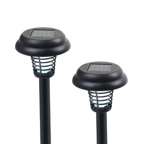 Two solar-powered bug zapper stakes with black housings, featuring a slatted design around the light source, are shown side by side. Each stake has a square solar panel on top, positioned above the light-emitting area.