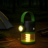 The lantern features a black body with a green handle and base, showcasing a spiral light element inside, along with a side spotlight. Its design is suitable for camping environments, set against a dark forest background.