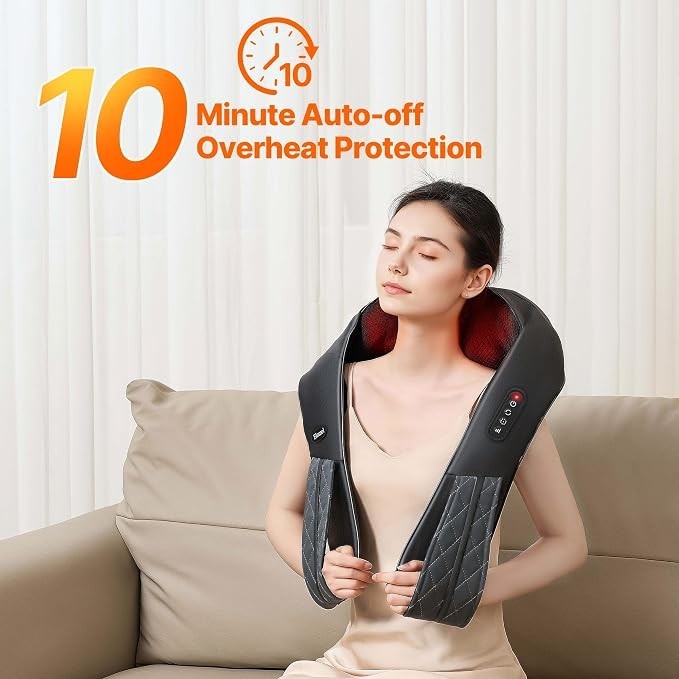 A woman is relaxing on a couch while wearing a black neck shoulder massager, which features a soft, quilted texture and red interior. The product demonstrates a digital display indicating a 10-minute auto-off function for overheat protection.