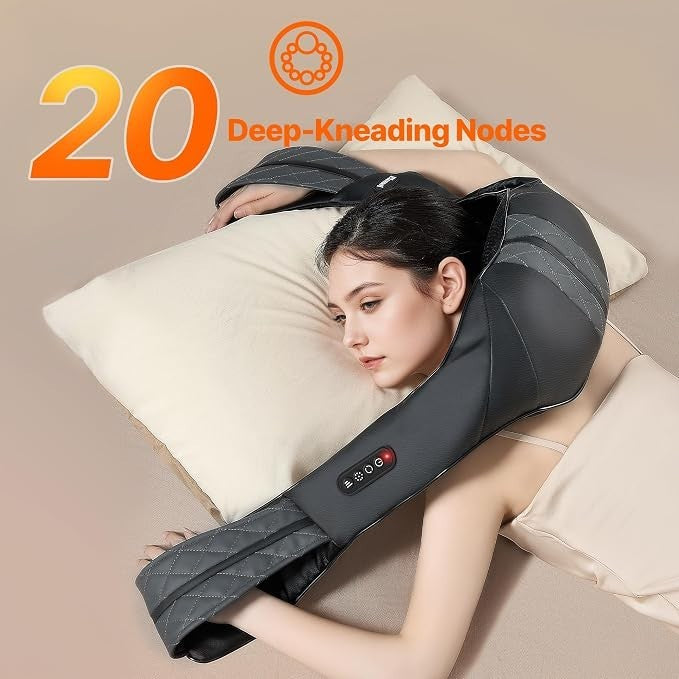 A woman relaxes with the neck shoulder massager draped over her shoulders while resting her head on a pillow, showing the massager's black fabric and control panel.