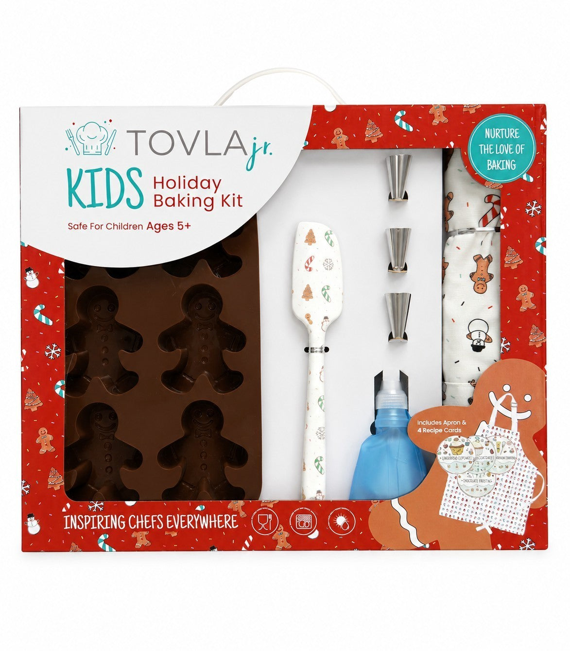 The kit features a brown silicone gingerbread mold, a white spatula adorned with festive designs, three piping nozzles, a blue squeeze bottle, and a cotton apron with a gingerbread print, all presented in a red holiday-themed box.