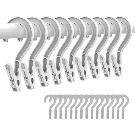 Set of 10 white plastic laundry hooks with clip hangers, each featuring a curved top for easy hanging over a rod. The arrangement shows the hooks in a row, with additional hooks displayed in the lower section.