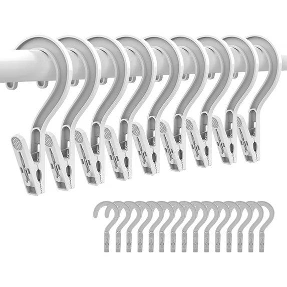 Set of 10 white plastic laundry hooks with clip hangers, each featuring a curved top for easy hanging over a rod. The arrangement shows the hooks in a row, with additional hooks displayed in the lower section.