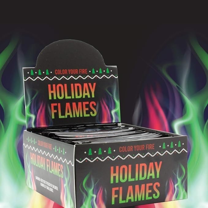 Display box for "Holiday Flames" featuring vibrant colors with graphic elements, including holiday trees and text stating "COLOR YOUR FIRE" and "HOLIDAY FLAMES." The background shows swirls of colorful flames in green, red, and purple.