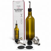 Tall, olive green glass dispenser bottle featuring two stainless steel spouts, accompanied by a funnel, cap, stopper, and labels, all arranged next to its packaging.