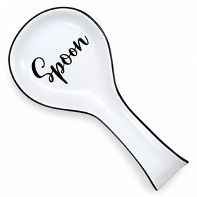 White ceramic spoon rest featuring a black cursive "Spoon" inscription and a sleek black trim, designed to be placed on kitchen counters or stove tops.