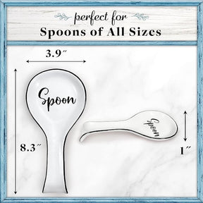 White ceramic spoon rest featuring the word "Spoon" in stylish black lettering, with dimensions measuring approximately 8.3 inches tall and 3.9 inches wide. The design includes one larger spoon rest and a smaller one, both showcasing a sleek and functional shape.