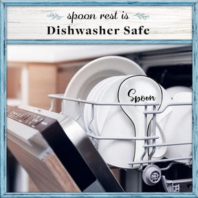 The white ceramic spoon rest is placed inside a dishwasher, featuring the word "Spoon" in a decorative font. Clean white plates are visible in the background.