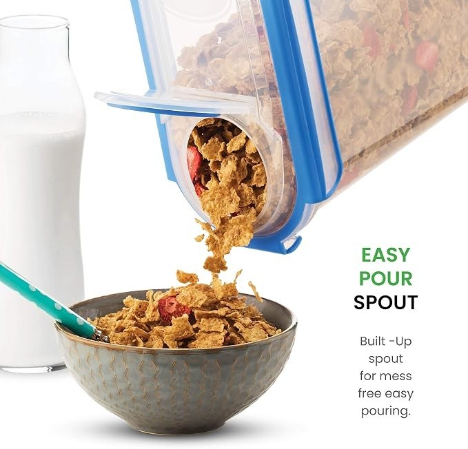 Extra large cereal container with a blue easy pour spout, dispensing cereal into a decorative gray bowl, alongside a glass of milk.