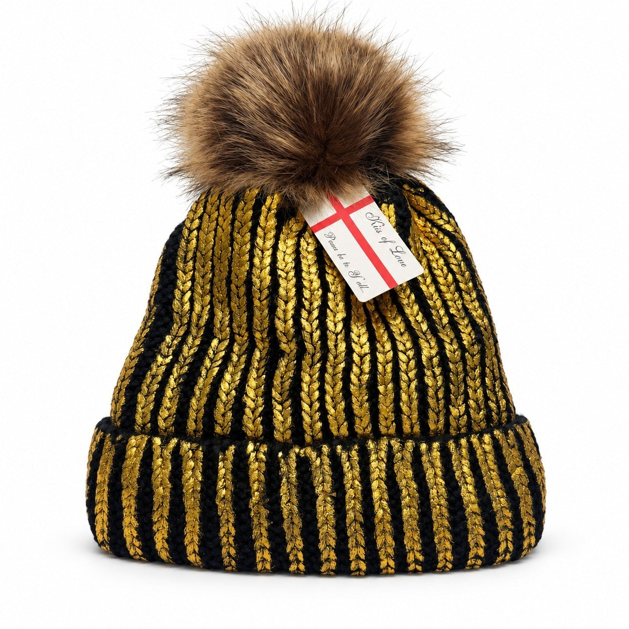 This winter beanie is designed with alternating gold and black stripe patterns, featuring a fluffy brown pom-pom on top and a warm fleece lining for added comfort. The bottom edge has a thick knitted cuff for a snug fit.