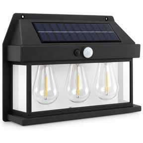Outdoor solar motion sensor light featuring three clear teardrop-shaped bulbs with yellow filaments, a black housing, and a top solar panel for energy collection. The light includes a motion sensor visible on the front for automatic activation.