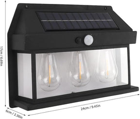 The outdoor light features a sleek black housing with a solar panel on top, three clear teardrop-shaped bulbs visible behind a frosted glass panel, and a motion sensor for added functionality. Dimensions indicate a length of 24 cm, height of 17 cm, and width of 6 cm.