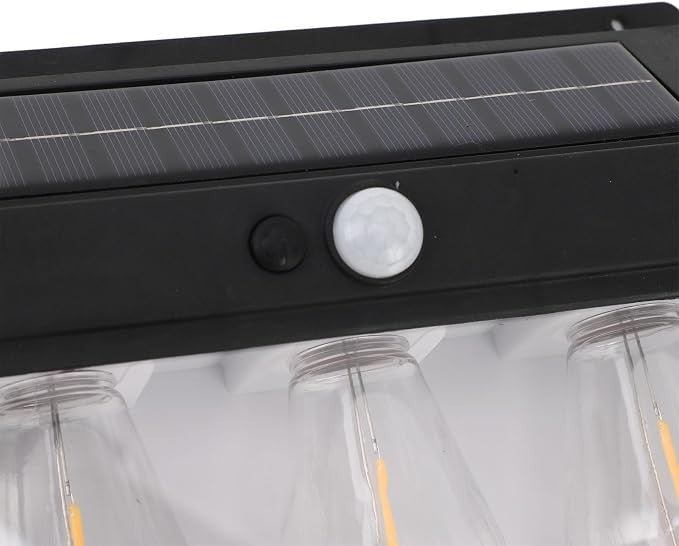 Top view of the solar motion sensor outdoor light showcasing the solar panel, motion sensor, and control button in a sleek black design, with lightbulb openings visible below.